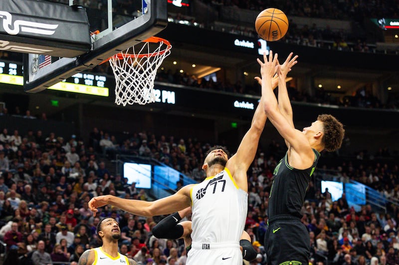Utah Jazz center Omer Yurtseven (77) and New Orleans Pelicans guard Dyson Daniels (11) jump up for the rebound during an NBA basketball game between the Utah Jazz and the New Orleans Pelicans at the Delta Center in Salt Lake City on Saturday, Nov. 25, 2023.