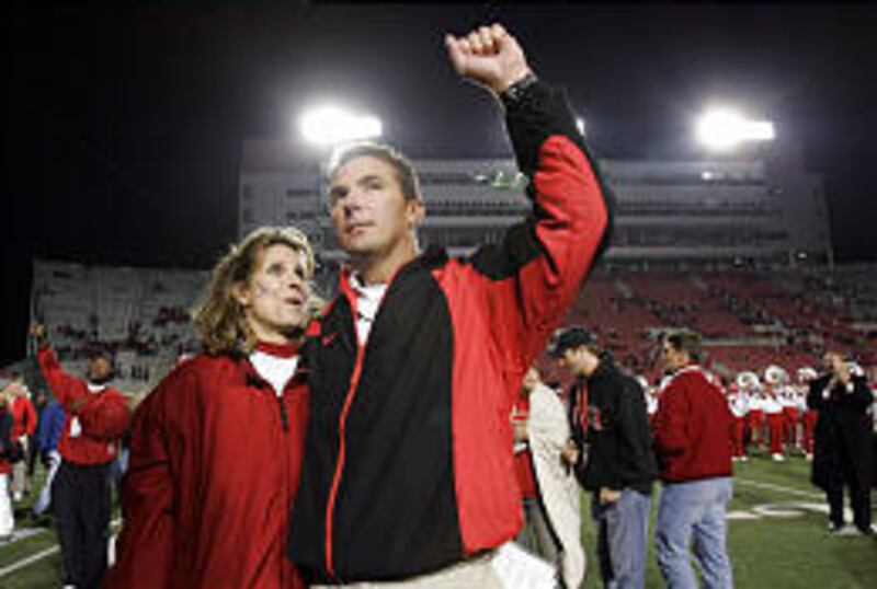 University of Utah coach Urban Meyer and wife Shelly acknowledge the crowd after a Ute victory over Colorado State on Nov. 6.