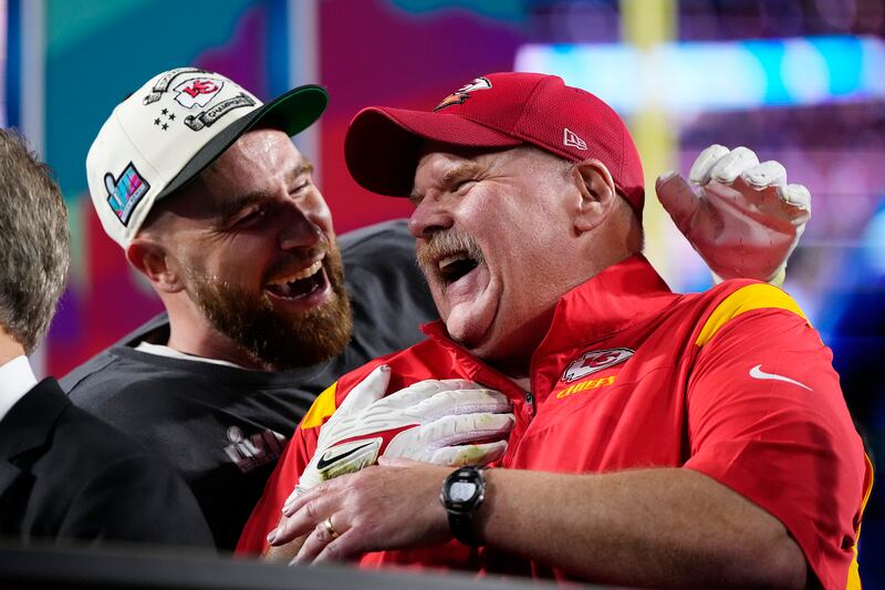 Kansas City Chiefs head coach Andy Reid, right, and Travis Kelce (87) celebrate their win after the NFL Super Bowl 57 football game, Sunday, Feb. 12, 2023, in Glendale, Ariz. The Chiefs defeated the Philadelphia Eagles 38-35.