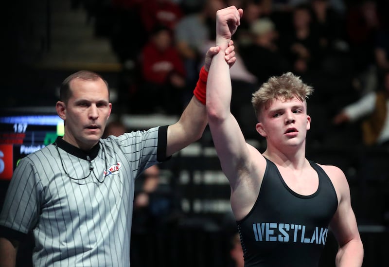Westlake’s Brayden Robinson is declared the winner of a wrestling match.