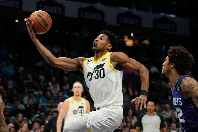 Utah Jazz guard Ochai Agbaji drives to the basket.