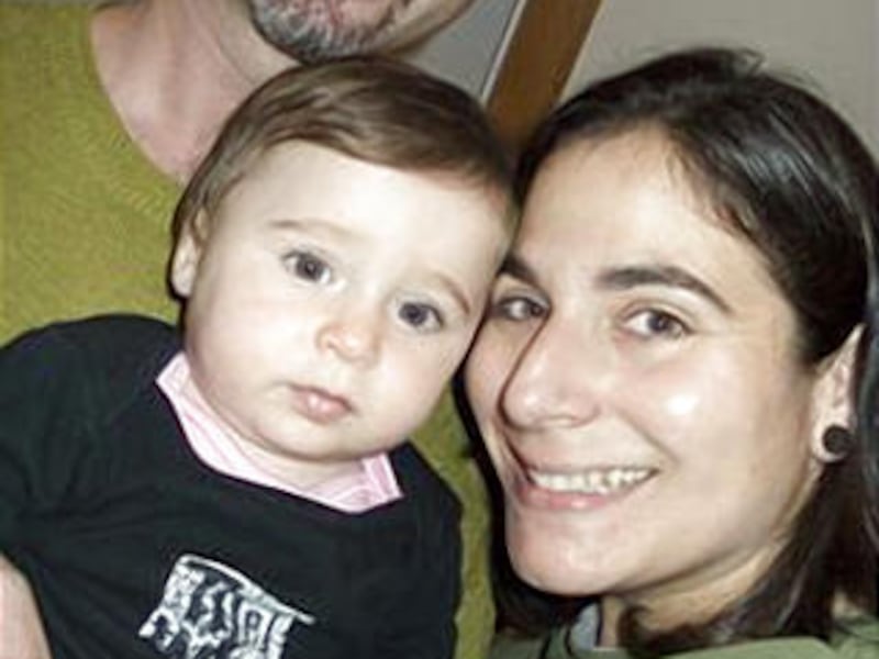 In this undated file family photo released by Illona Lieberman, Andrew Koppel, top left, is seen with his girlfriend Illona Lieberman and their daughter Alice Juliet.
