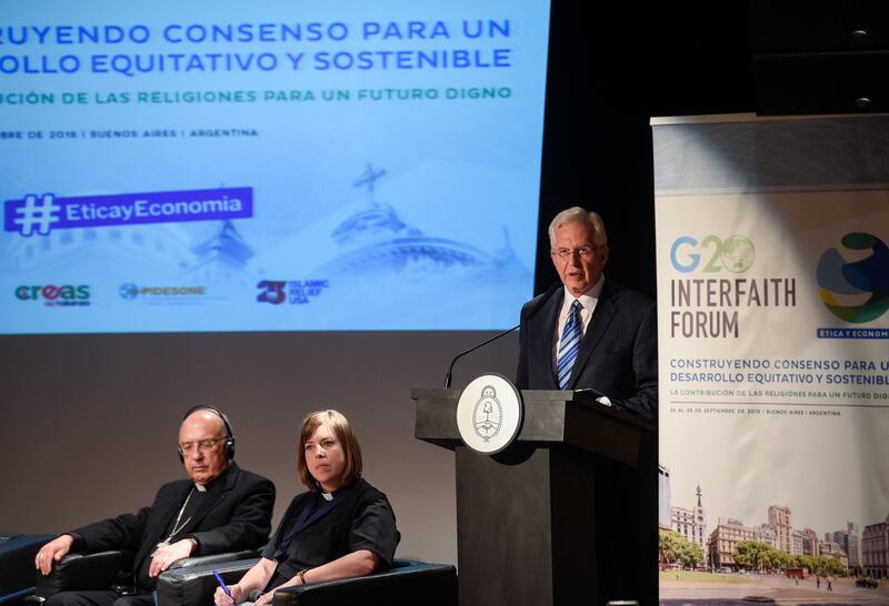 Elder D. Todd Christofferson, right, a member of the Quorum of the Twelve Apostles of The Church of Jesus Christ of Latter-day Saints, speak at the G20 Interfaith Forum in Buenos Aires, Argentina, on Wednesday, Sept. 26, 2018.
