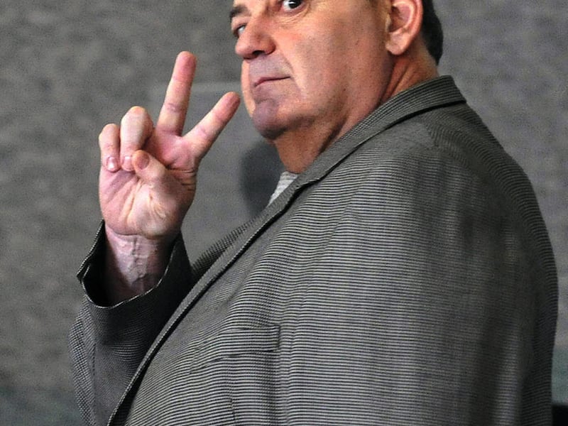 FILE - In this Nov. 10, 2010 file photo, reputed mob boss, Michael Sarno walks through the federal building in Chicago during a break in his racketeering trial. A federal judge in Chicago sentenced Michael "The Large Guy" Sarno to 25 years in prison and o