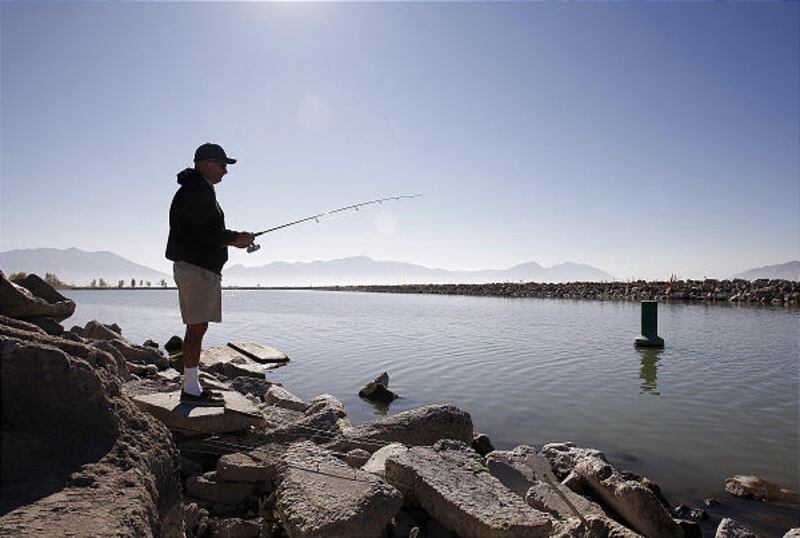 Randy Smith from Salt Lake City spends some time fishing on Monday at Utah Lake State Park in Provo.