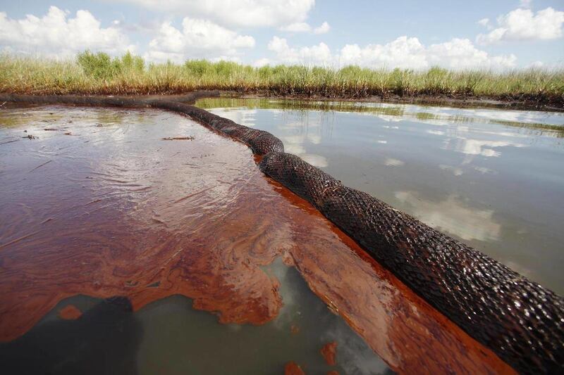 FILE - In this June 26, 2010 file photo, oil from the Deepwater Horizon oil spill is seen floating on the surface of the water in Bay Jimmy in Plaquemines Parish, La. A new oil sheen was spotted in the Gulf of Mexico, although energy company BP said Th