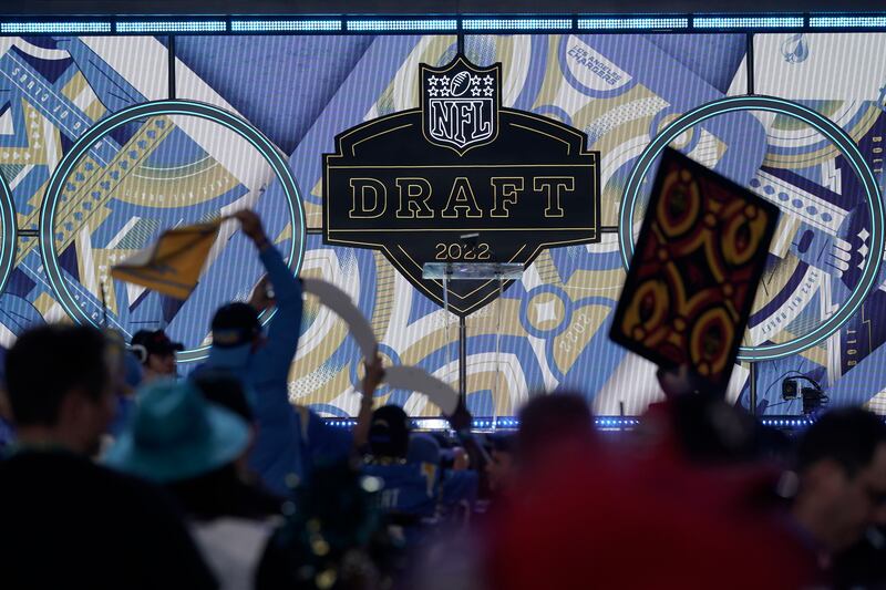 Fans cheer during the third round of the NFL football draft Friday, April 29, 2022, in Las Vegas.