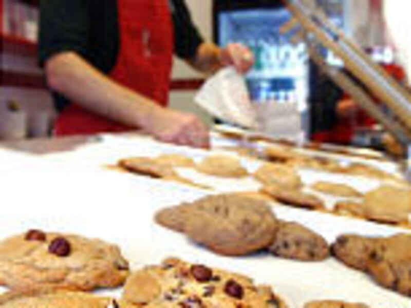 Joel Clark sells cookies at The Gateway, the second Utah outlet.