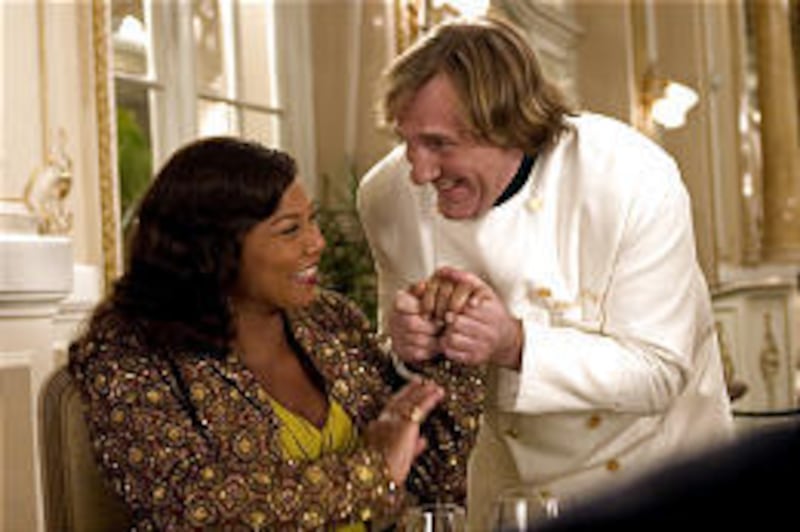 Georgia Byrd (Queen Latifah) meets Chef Didier (Gerard Depardieu) during a European vacation in "Last Holiday."