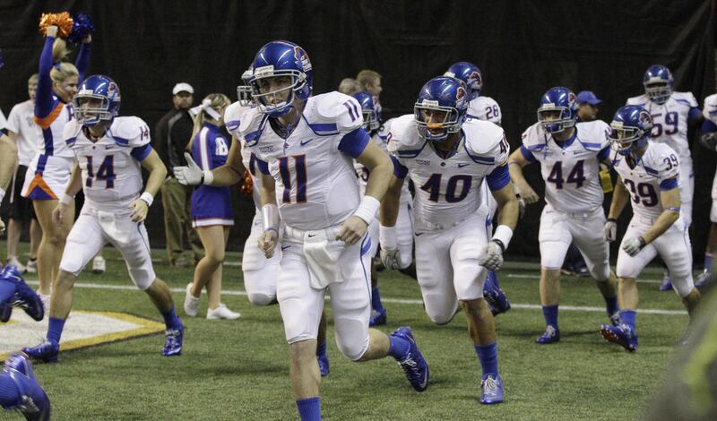 FILE - This Nov. 12, 2010, file photo shows Boise State quarterback Kellen Moore (11) running onto the field in the Kibbie Dome for an NCAA college football game against Idaho, in Moscow, Idaho. Thanks to the Heisman-finalist and a talented cast around h