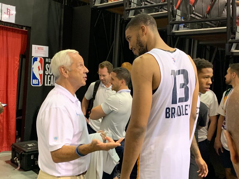North Carolina coach Roy Williams chats with Utah Jazz center Tony Bradley following the Jazz’s 97-93 win over the Portland Trail Blazers on Tuesday, July 9, 2019, at Las Vegas’s Cox Pavilion. Bradley won a national title with the Tar Heels as a freshman