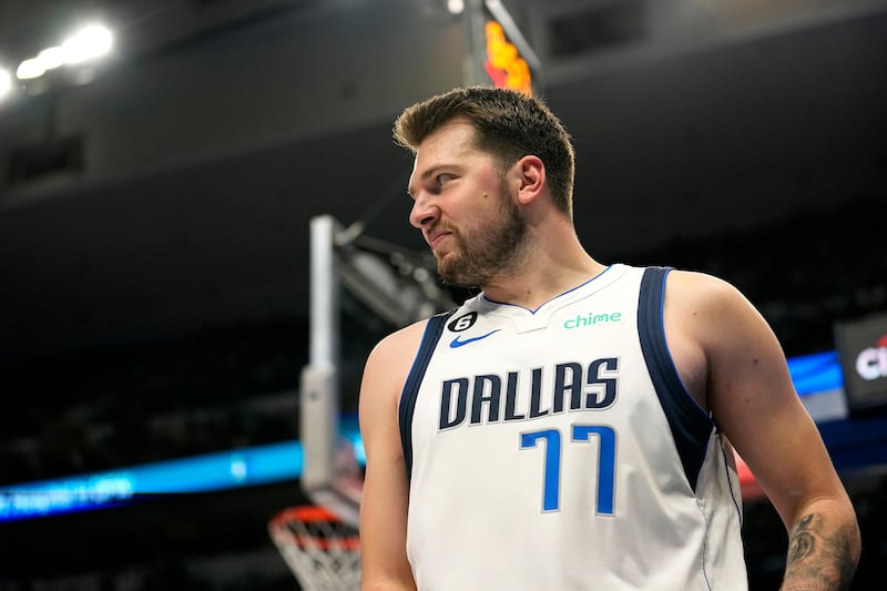 Dallas Mavericks guard Luka Doncic smiles after attempting a basket in an NBA basketball game against the Chicago Bulls, Friday, April 7, 2023, in Dallas.