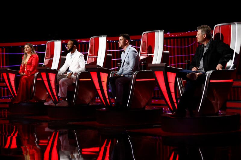 “The Voice” coaches Kelly Clarkson, John Legend, Nick Jonas and Blake Shelton are pictured during the season finale.