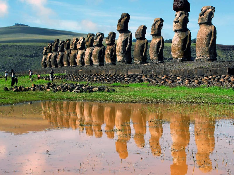 In this Feb. 2007 file photo, giant volcanic rock statues called Moais are shown on Easter Island in the South Pacific. Easter Island is Earth's most remote inhabited land, a South Pacific speck of volcanic rock so isolated the locals call it "Te Pito O T