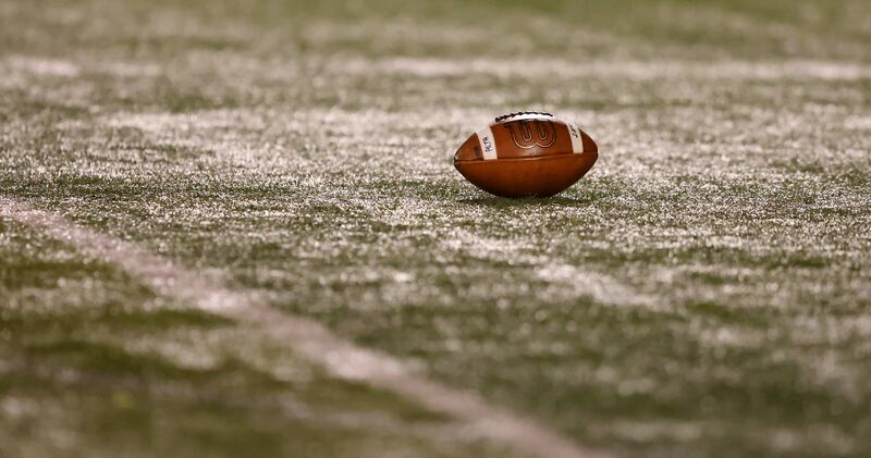 A football sits on the field