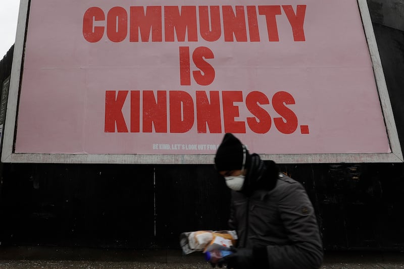 An advertising display in London, Wednesday, April 1, 2020, stating “Community is Kindness.”