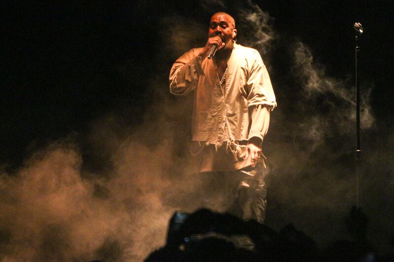 Kanye West performs during FYF Fest in 2015. Investors are suing Adidas over its collaboration with the performer.