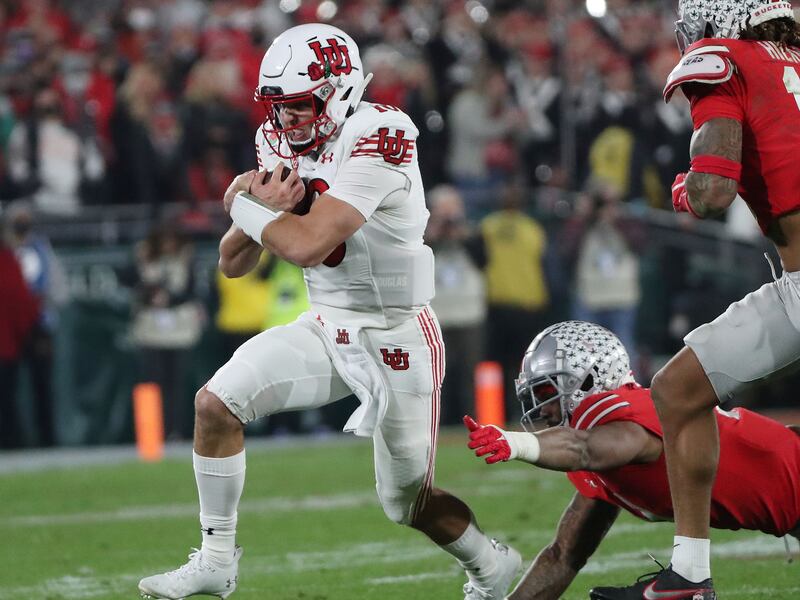 Utah Utes quarterback Bryson Barnes (16) runs during the Rose Bowl in Pasadena