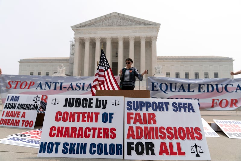 A person protests outside of the Supreme Court in Washington.
