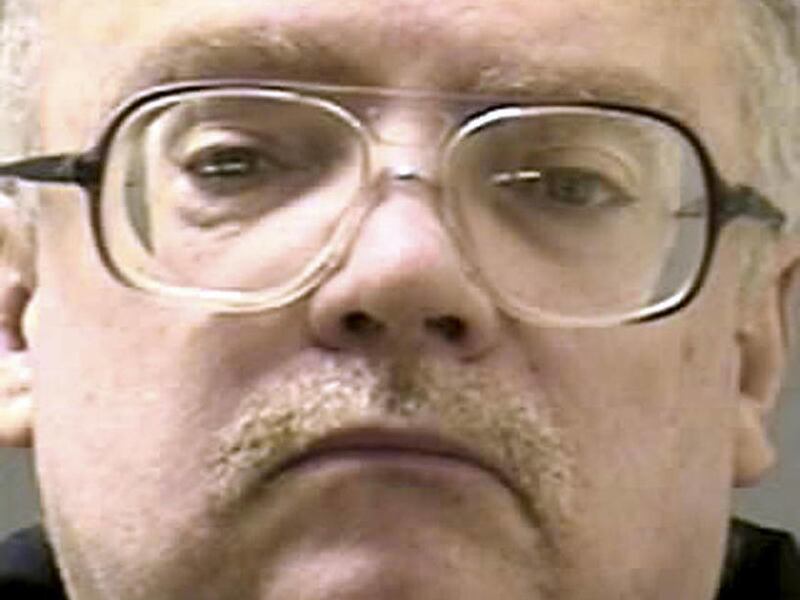 FILE - This March 1, 2011 inmate file photo released by the Rhode Island Department of Corrections shows Michael Woodmansee. Woodmansee has served prison time for killing a 5-year-old boy in 1975 and keeping his shellacked bones in his house for years. He