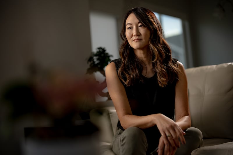 Staci Robison sits in her Utah home.