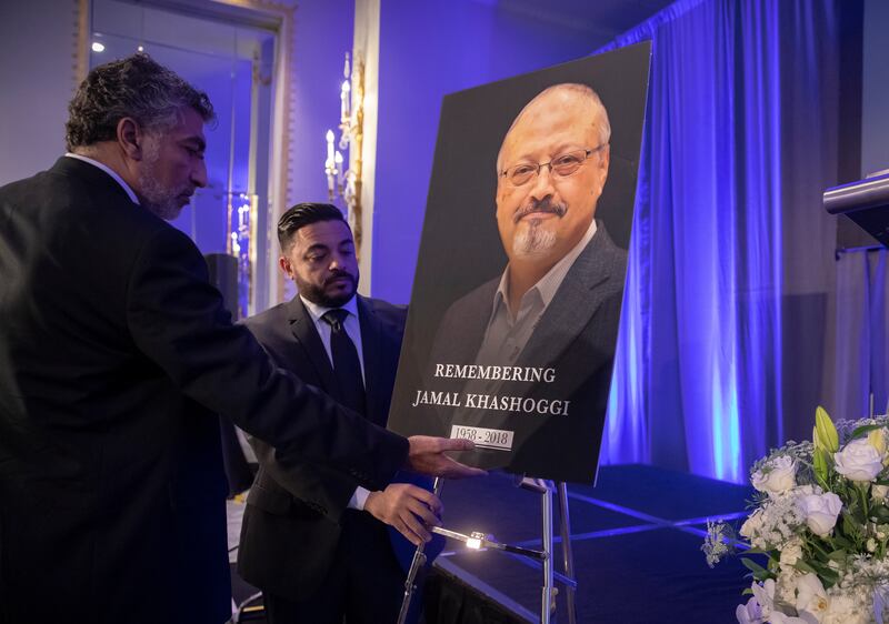 Mongi Dhaouadi, left, and Ahmed Bedier set up an image of slain Saudi journalist Jamal Khashoggi before an event to remember Khashoggi, a columnist for The Washington Post who was killed inside the Saudi Consulate in Istanbul on Oct. 2, in Washington, Fri
