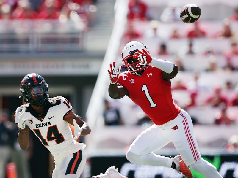 Utah Utes’ DB Clark Phillips III (1) steps in front of Oregon State Beavers wide receiver John Dunmore (14) for a pick-six.