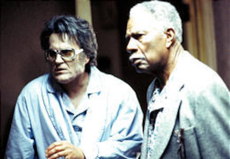 Elvis (Bruce Campbell) and JFK (Ossie Davis) search for a mummy.
