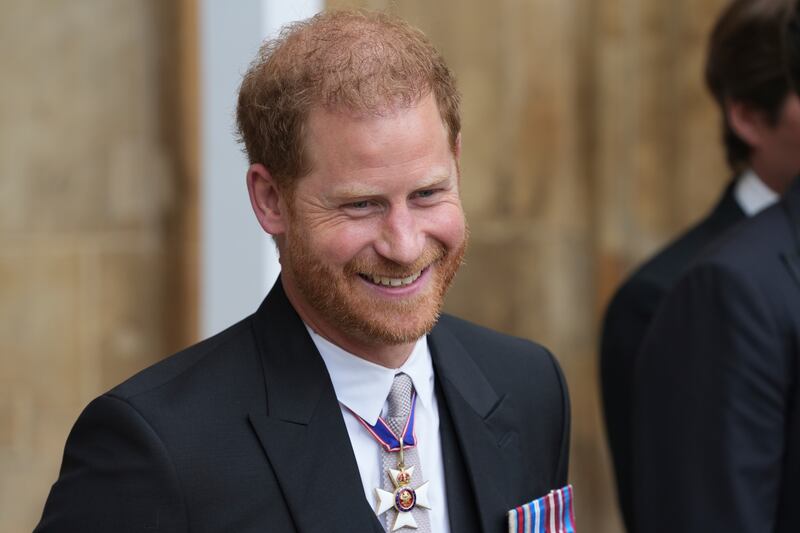 Prince Harry leaves Westminster Abbey after the coronation of King Charles III in London.