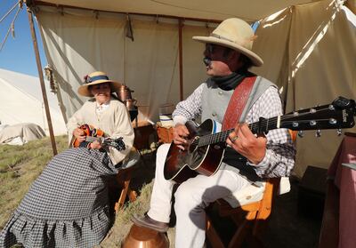 Mike Rudoff and Susy Epperson sing during the 150th anniversary celebration at the Golden Spike National Historical Park at Promontory Summit on Friday, May 10, 2019.