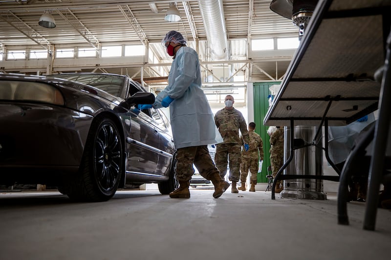 Members of the Utah National Guard work at a COVID-19 testing center