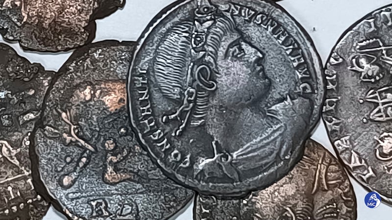 A picture made available by the Italian Culture Minister shows some recently discovered ancient bronze coins