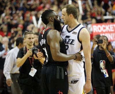 Houston Rockets guard James Harden (13) hugs Utah Jazz forward Joe Ingles (2) after the Jazz lost Game 5 of the NBA playoffs at the Toyota Center in Houston on Tuesday, May 8, 2018. The Jazz lost 102-112.