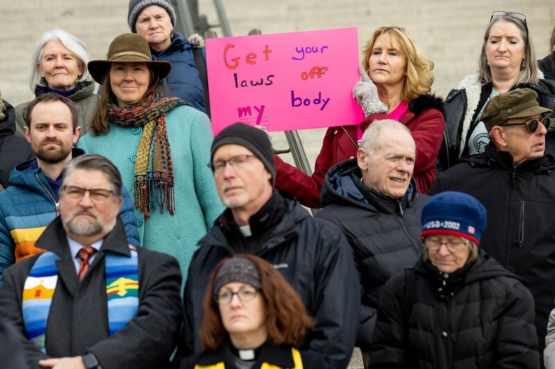 Marilyn Smith, of the South Valley Unitarian Universalist Society, holds a sign while standing with other faith leaders who are filing an amicus brief in support of Planned Parenthood Association of Utah in its lawsuit challenging Utah’s abortion ban at the Capitol in Salt Lake City on Thursday.