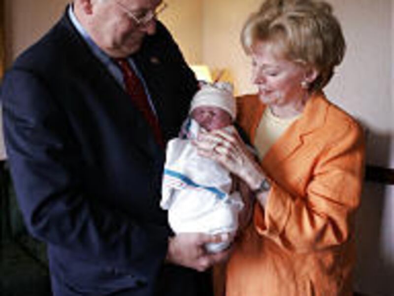 Vice President Dick Cheney and his wife, Lynne, hold their fourth grandchild, Philip Richard Perry.