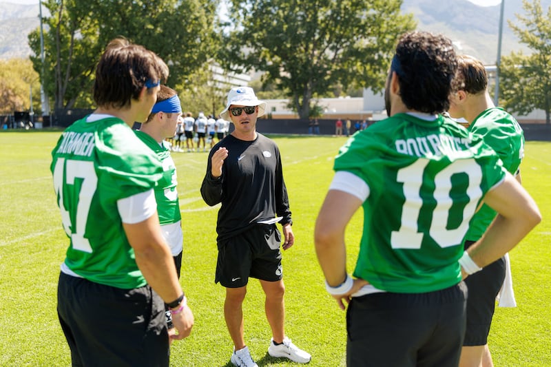 BYU offensive coordinator Aaron Roderick meets with his QBs on July 31, 2025 in Provo. Saturday, the Cougars will stage their first scrimmage of fall camp, which could go a long way in determining who will be the Cougars' starting QB this fall.