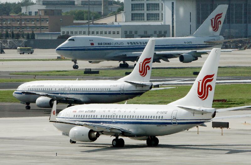 Air China planes sit on the tarmac at Beijing Airport in Beijing, China on Aug. 20, 2009.