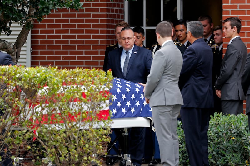 The casket of Alaina Petty, a victim of a mass shooting at Marjory Stoneman Douglas High School, leaves her funeral in Coral Springs, Fla., Monday, Feb. 19, 2018.
