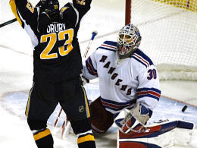 Buffalo Sabres center Chris Drury (23) celebrates in front of New York Rangers goalie Henrik Lundqvist after tying the game.