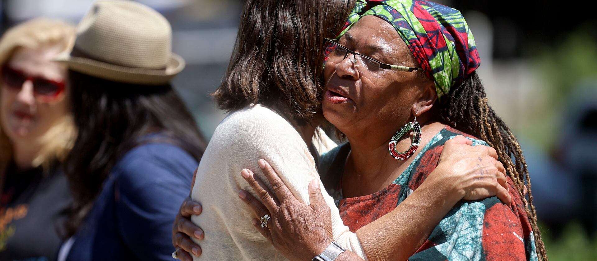 Salt Lake City Mayor Erin Mendenhall hugs Betty Sawyer after a Juneteenth flag-raising ceremony.