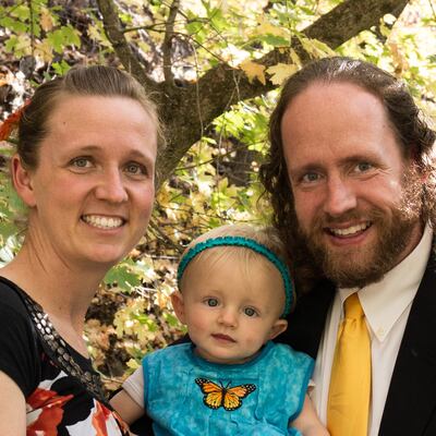 Darci Stone with her husband, Eric, and their daughter.
