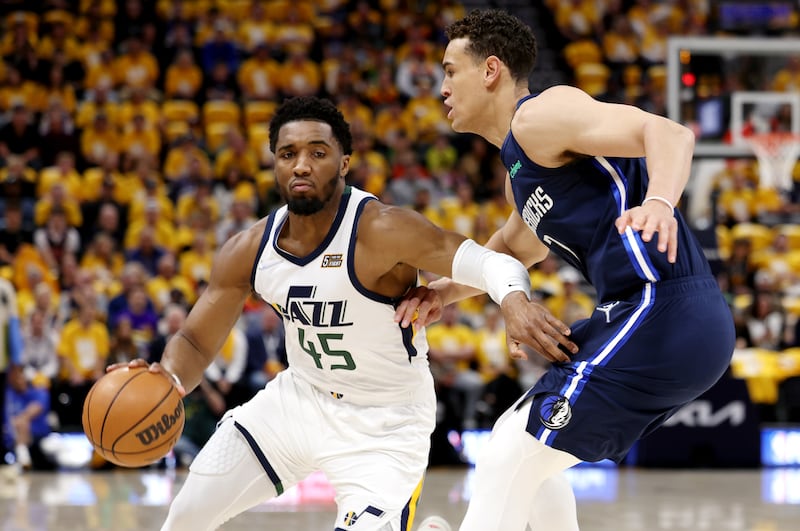 Utah Jazz’s Donovan Mitchell drives around Dallas’ Dwight Powell in Game 4 of a first-round playoff series in Salt Lake City.