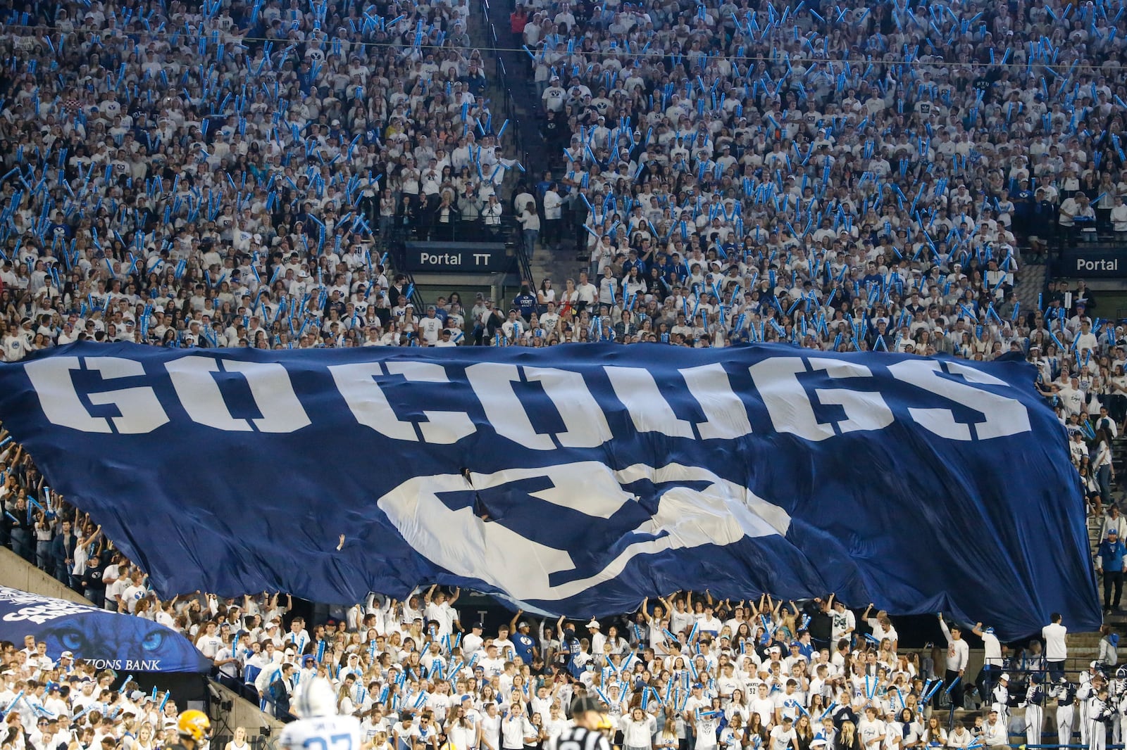 Fans cheer as BYU and Arizona State compete during a college football game at LaVell Edwards Stadium.