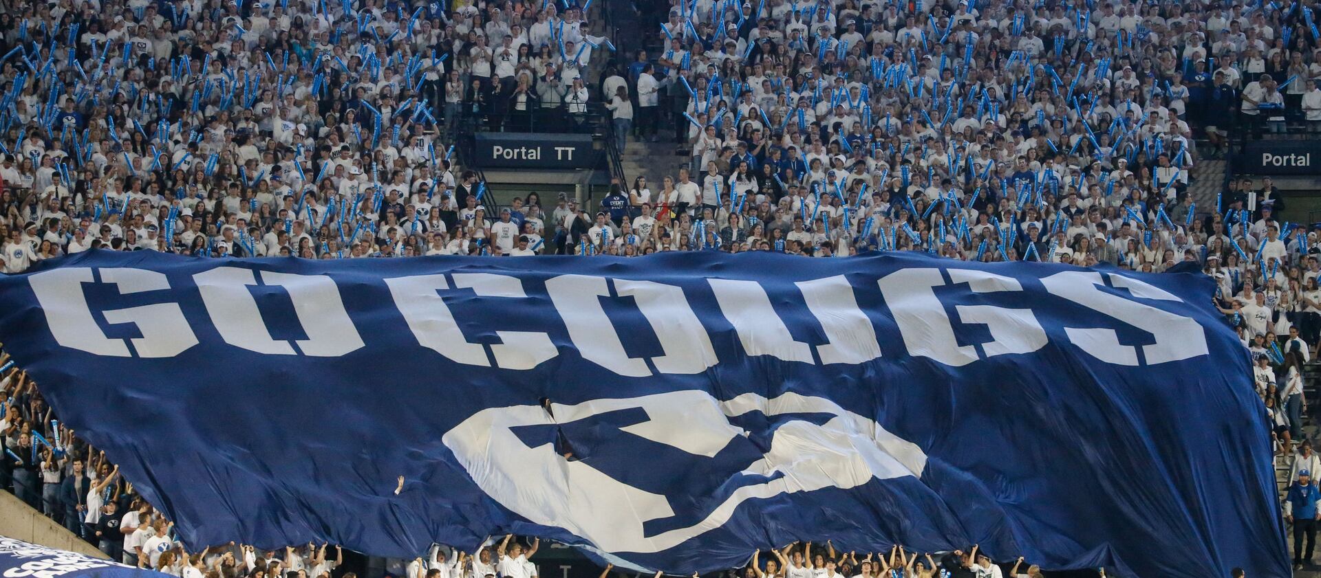 Fans cheer as BYU and Arizona State compete during a college football game at LaVell Edwards Stadium.