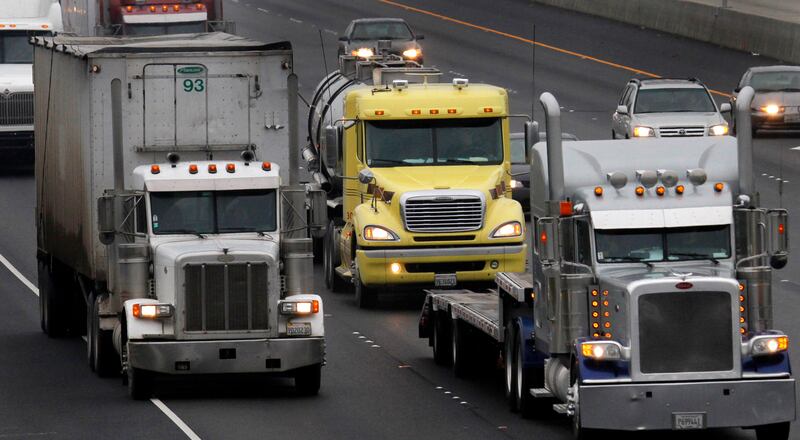 Trucks travel eastbound on I-580 in Livermore, Calif. California is seeking to ban the sale of commercial diesel vehicles by 2040.