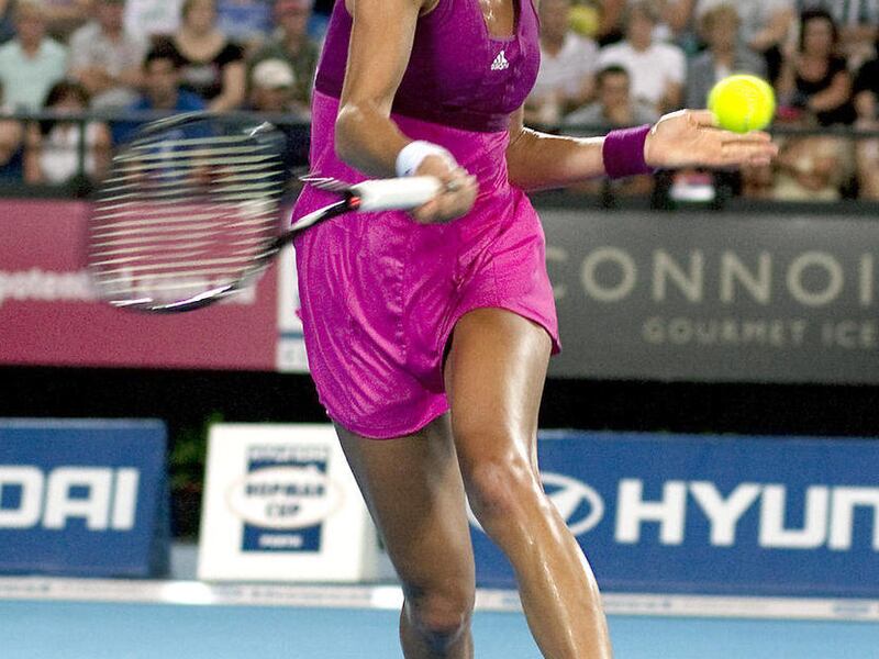 Serbian Ana Ivanovic plays a forehand on her way to defeat Kazakhstans' Yaroslava Shvedova in straight sets on day two of the Hopman Cup team tennis tournament in Perth, Australia, Sunday, Jan. 2, 2011.