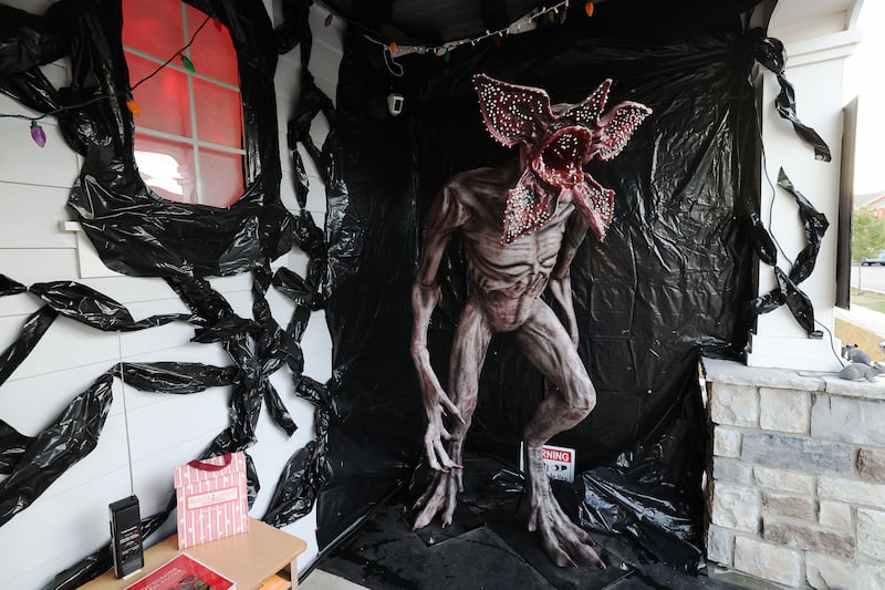 A “Stranger Things” monster is pictured on a porch of a house in South Jordan.