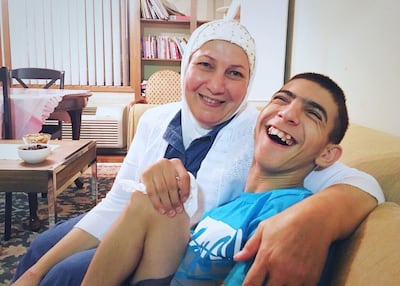 Dr. Heval Kelli's mother, Saadia Mohamed Kelli, with a Syrian refugee in Georgia.