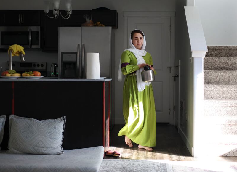Nazdanah carries a pot of tea in her Herriman home on Wednesday, Aug. 31, 2022.